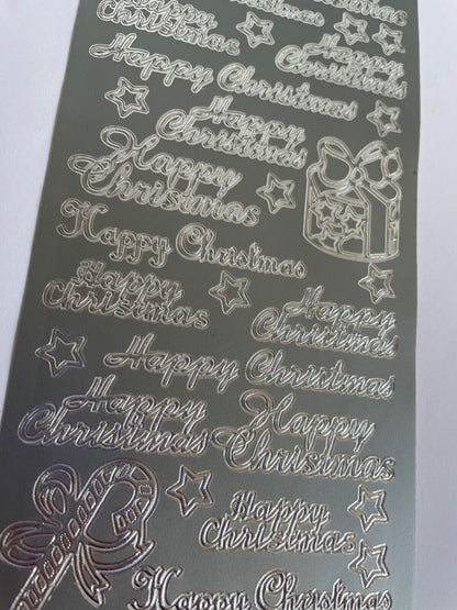 Close-up of silver Happy Christmas peel off greetings for handmade card