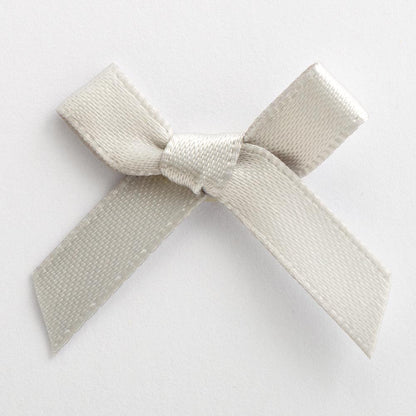 Silver mini satin ribbon bow made from 6mm ribbon, approximately 3cm wide
