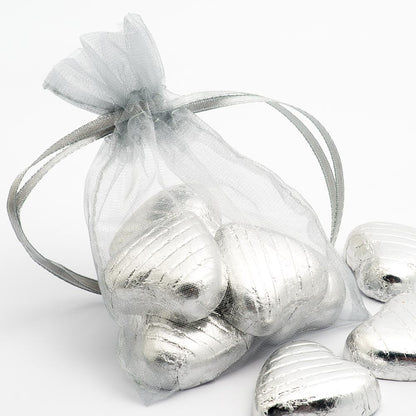 Silver organza wedding favour bag filled with sweets