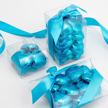 Turquoise chocolate heart wedding favours displayed in a gift box