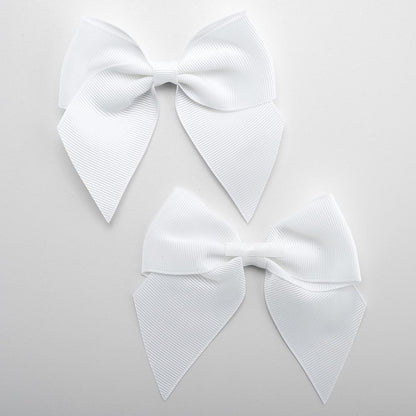 Front and back of white 10cm grosgrain bow showing the self-adhesive strip
