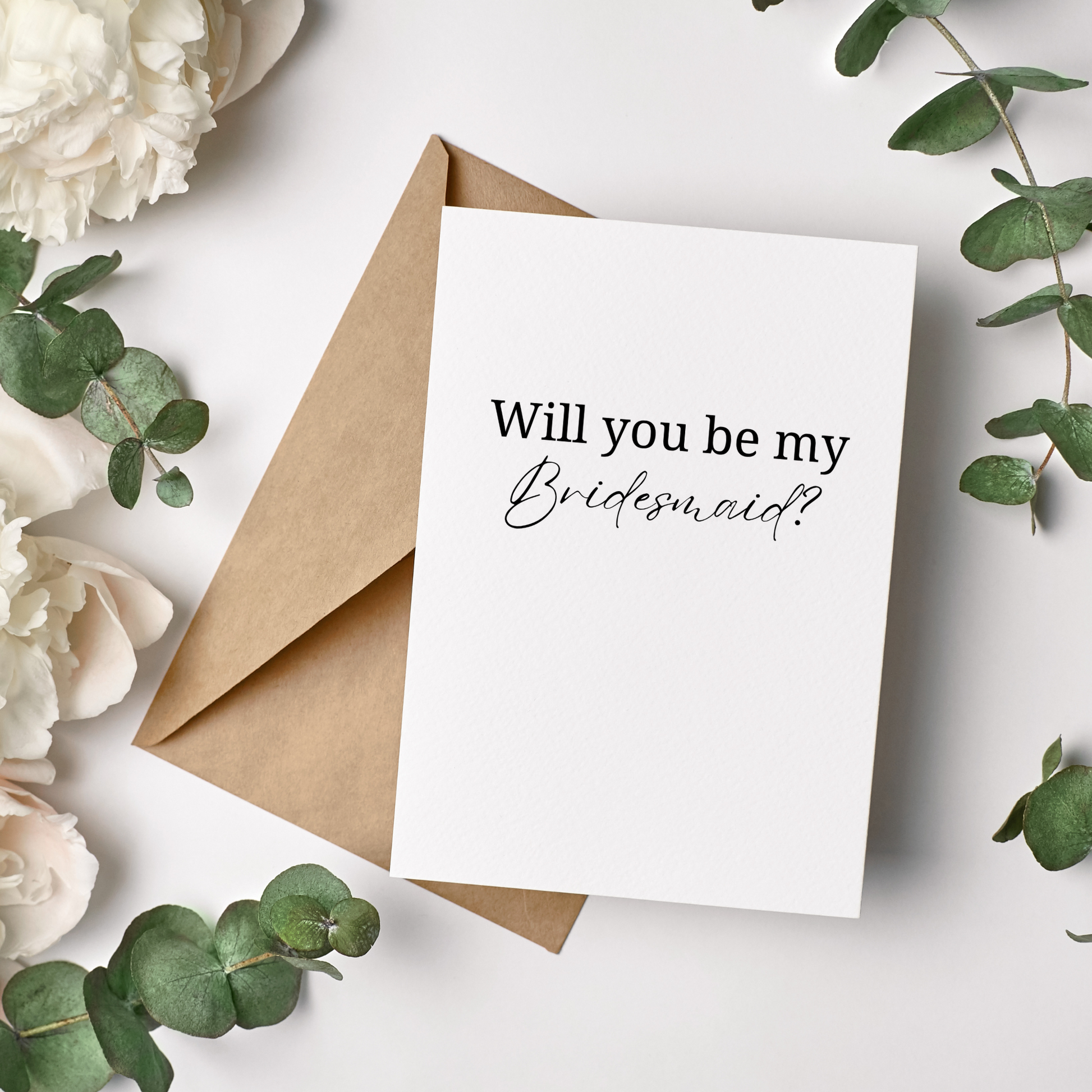 Bridesmaid Proposal Card with 'Will you be my Bridesmaid?' text on a white background with flowers and greenery.