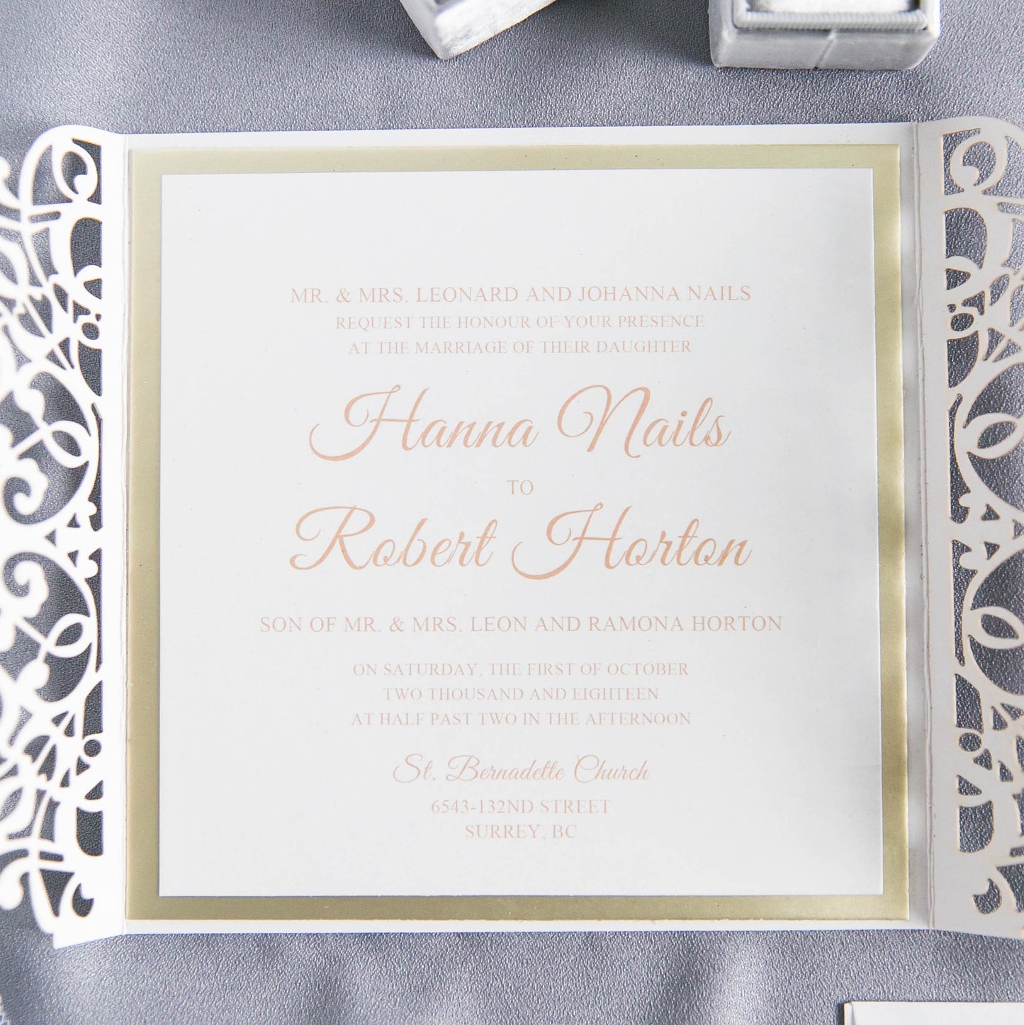 open wedding invitation with printed details