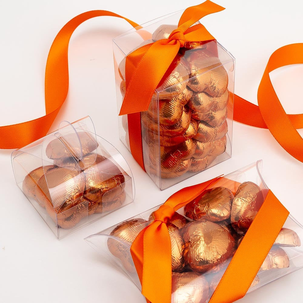 Copper chocolate heart wedding favours displayed in a gift box