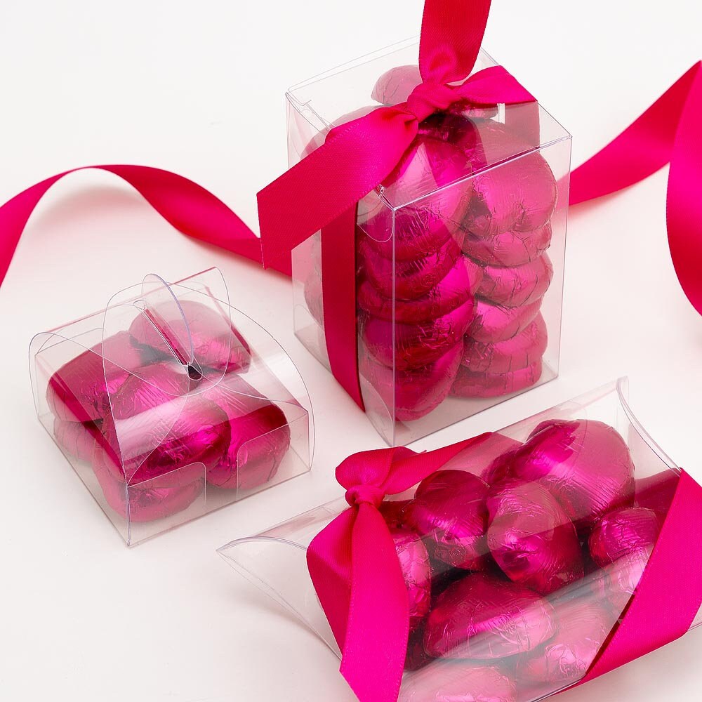 Hot pink chocolate heart wedding favours displayed in a gift box