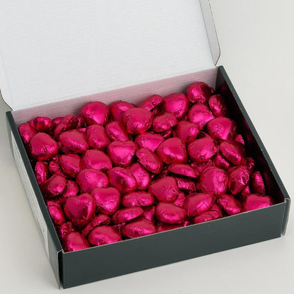 Hot pink foil heart chocolates for wedding favours and table settings