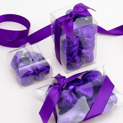Purple chocolate heart wedding favours displayed in a gift box