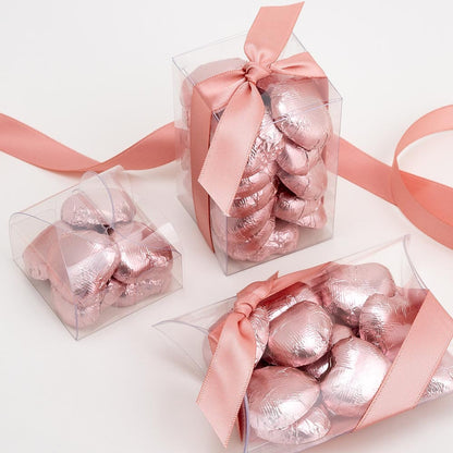 Rose gold chocolate heart wedding favours displayed in a gift box