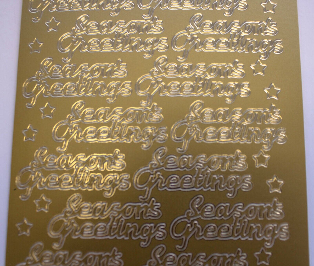 Close up of greetings for Christmas card making saying seasons greetings