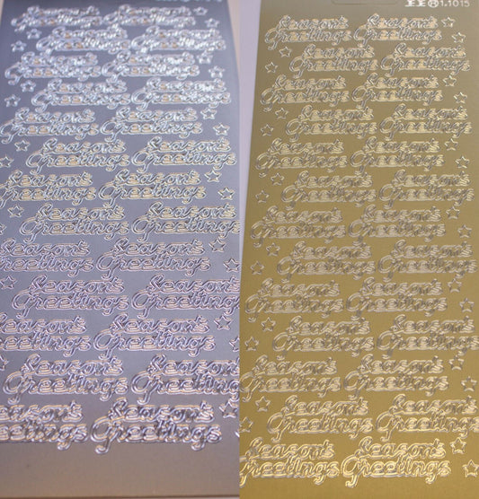 Gold and silver sheets of seasons greetings Christmas poeel off stickers