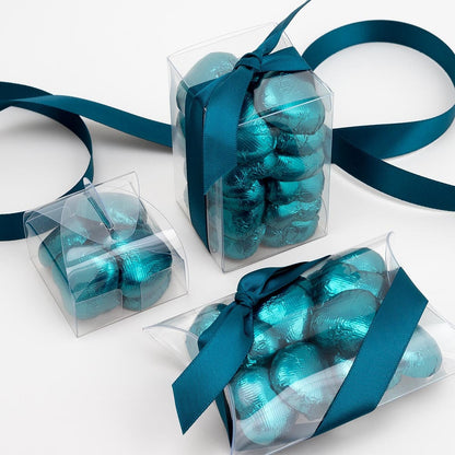 Teal chocolate heart wedding favours displayed in a gift box